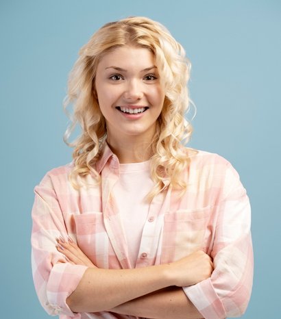 closeup smiling cheerful blonde teenager with cros JXSABHQ