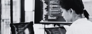 it programmer starts working on desktop computer QNZ5XTN